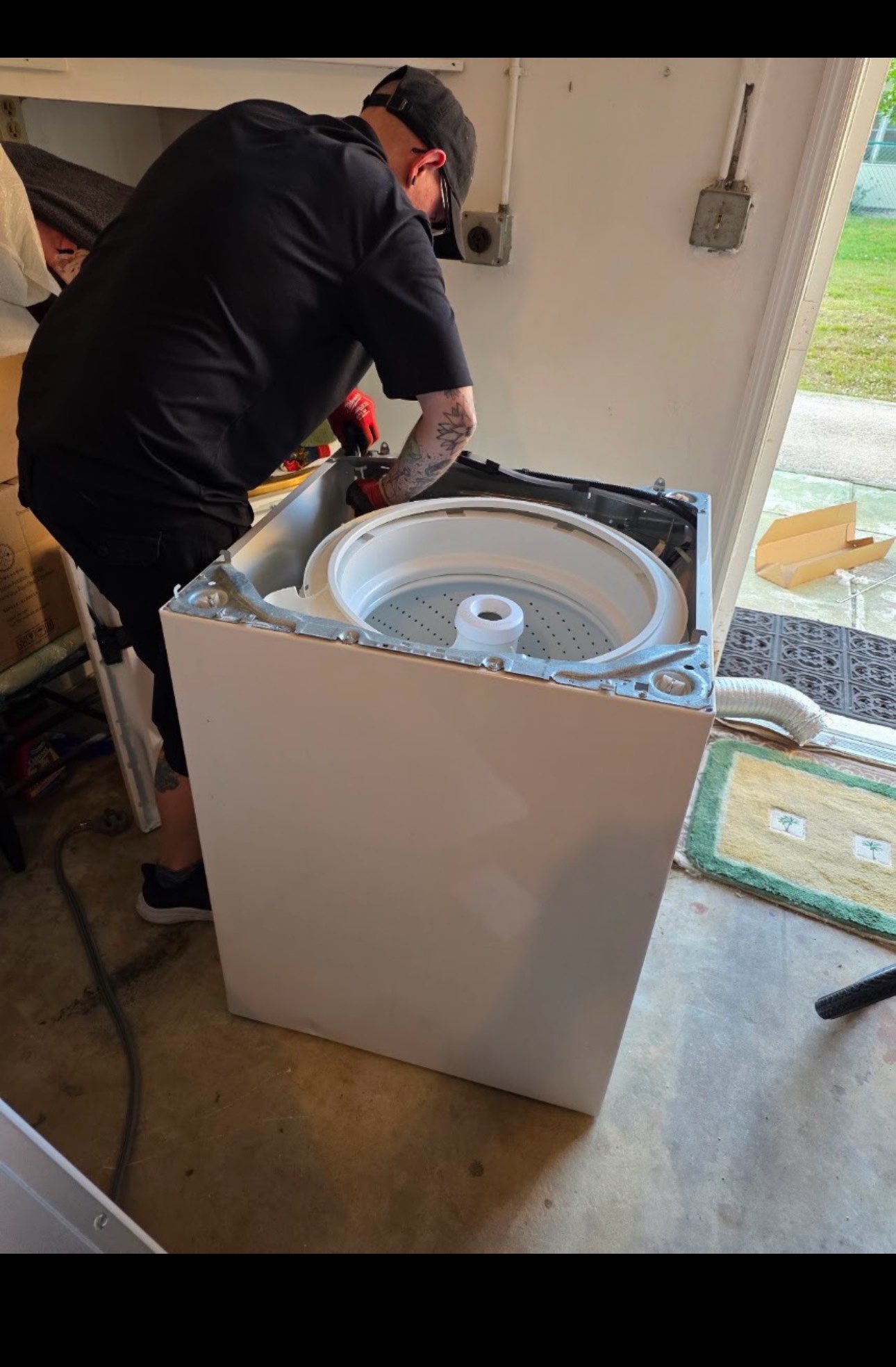 Technician working on a washing machine repair