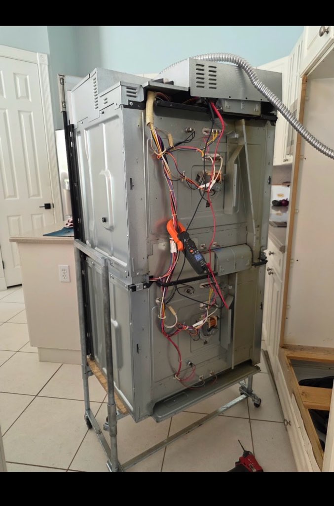 Refrigerator repair diagnostics in progress